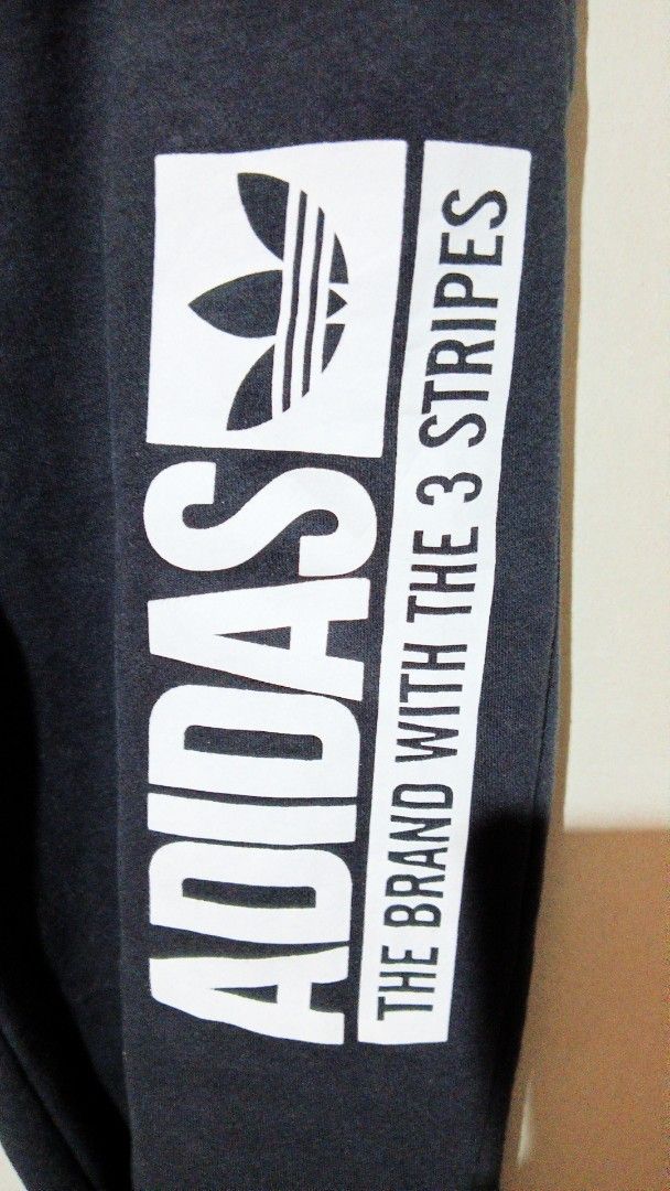 Adidas 3/4 Track Pant Black Size 36 (Category: Joggers) located in Manila. Submitted by zambee16 (Listing ID 1470665925, Image 3). Description: - Brand: Adidas - Item: 3/4 Track Pants - Color: Black with white logo print - Condition: Brand new with original tags attached - Features: Elastic drawstring waist and trendy raw hem cuffs - Perfect for casual wear or workouts.