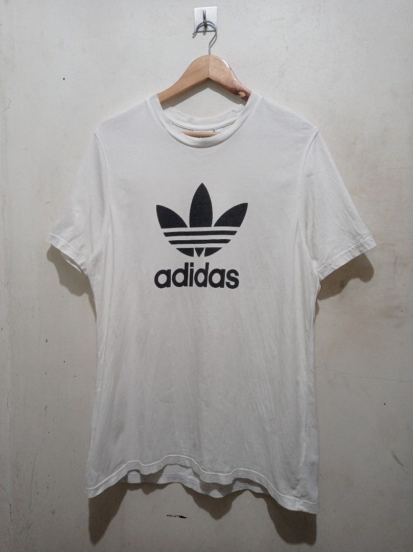 Adidas Adicolor Trefoil Tee (Category: Tshirts & Polo Shirts ) located in Pasig City. Submitted by pureselectionapparel (Listing ID 1470640078, Image 1). Description: Adidas Adicolor Trefoil Tee 🏷️ Size large on tag (21 W 30L) Very Good Condition Issue: Small stickhole (check last photo) 250 plus ship Location: Pasig City.