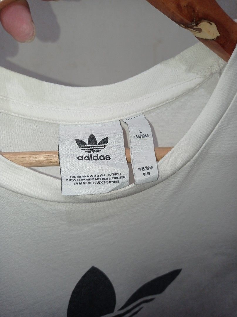 Adidas Adicolor Trefoil Tee (Category: Tshirts & Polo Shirts ) located in Pasig City. Submitted by pureselectionapparel (Listing ID 1470640078, Image 3). Description: Adidas Adicolor Trefoil Tee 🏷️ Size large on tag (21 W 30L) Very Good Condition Issue: Small stickhole (check last photo) 250 plus ship Location: Pasig City.