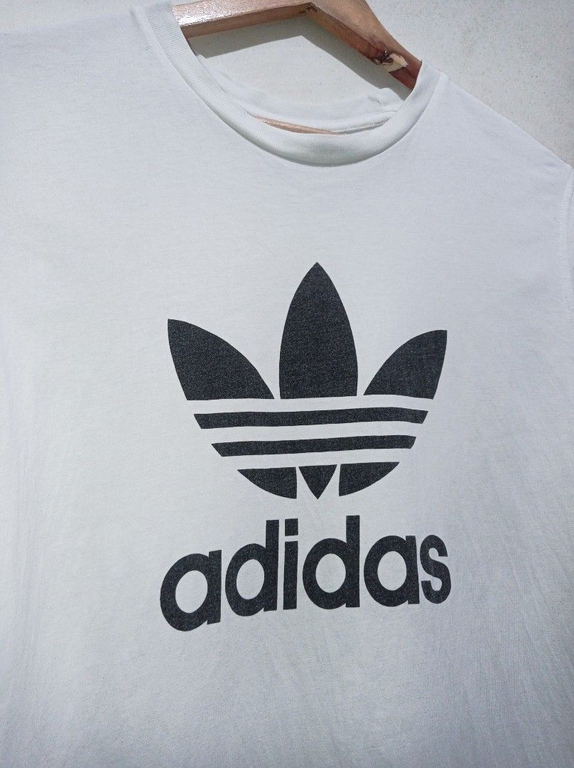 Adidas Adicolor Trefoil Tee (Category: Tshirts & Polo Shirts ) located in Pasig City. Submitted by pureselectionapparel (Listing ID 1470640078, Image 2). Description: Adidas Adicolor Trefoil Tee 🏷️ Size large on tag (21 W 30L) Very Good Condition Issue: Small stickhole (check last photo) 250 plus ship Location: Pasig City.