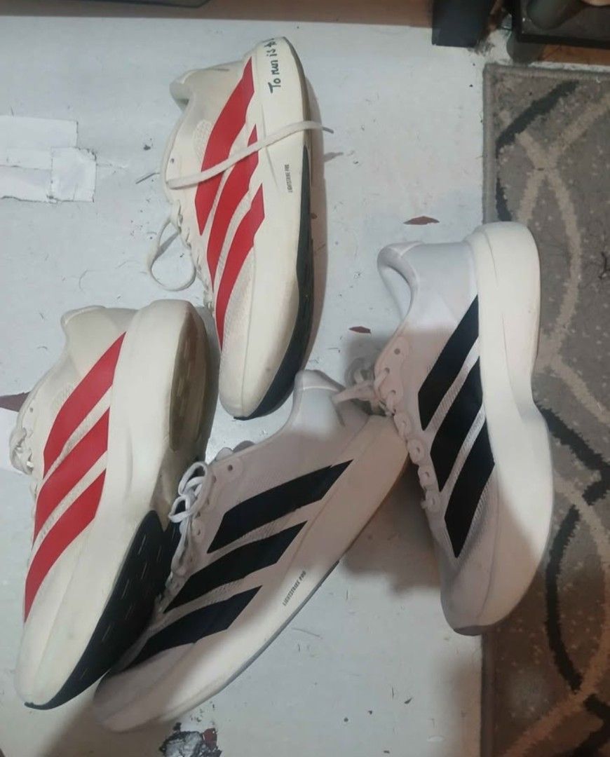 Adidas Adizero Running Shoes (Category: Shoe inserts & accessories) located in Manila. Submitted by jonwick31 (Listing ID 1470641070, Image 2). Description: - Bundle includes 2 pairs of Adidas Adizero running shoes: White/Red and White/Black - Ultra-lightweight mesh boths size 11 no box OEM po ito 2500 for both as pack only qc.