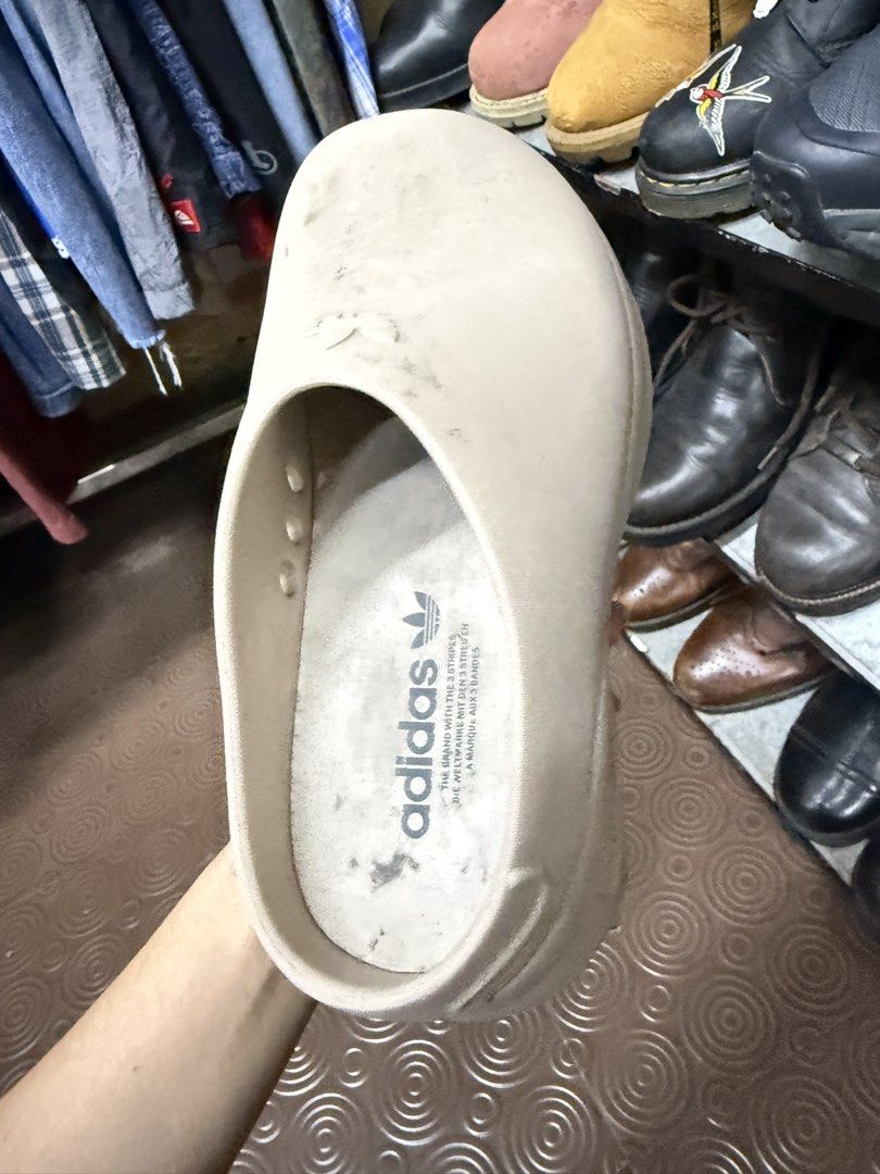Adidas Beige Platform Clogs Slip-On Shoes (Category: Sneakers) located in Abucay. Submitted by fastlion.584bdf (Listing ID 1470649776, Image 2). Description: - Brand: Adidas - Style: Platform clogs / slip-on mules - Color: Beige - Features: Chunky sole, side ventilation holes, debossed heel branding, printed Trefoil logo on insole, circular tread pattern - Condition: Pre-loved with minor dirt and scuffs from wear - Perfect for daily casual wear a