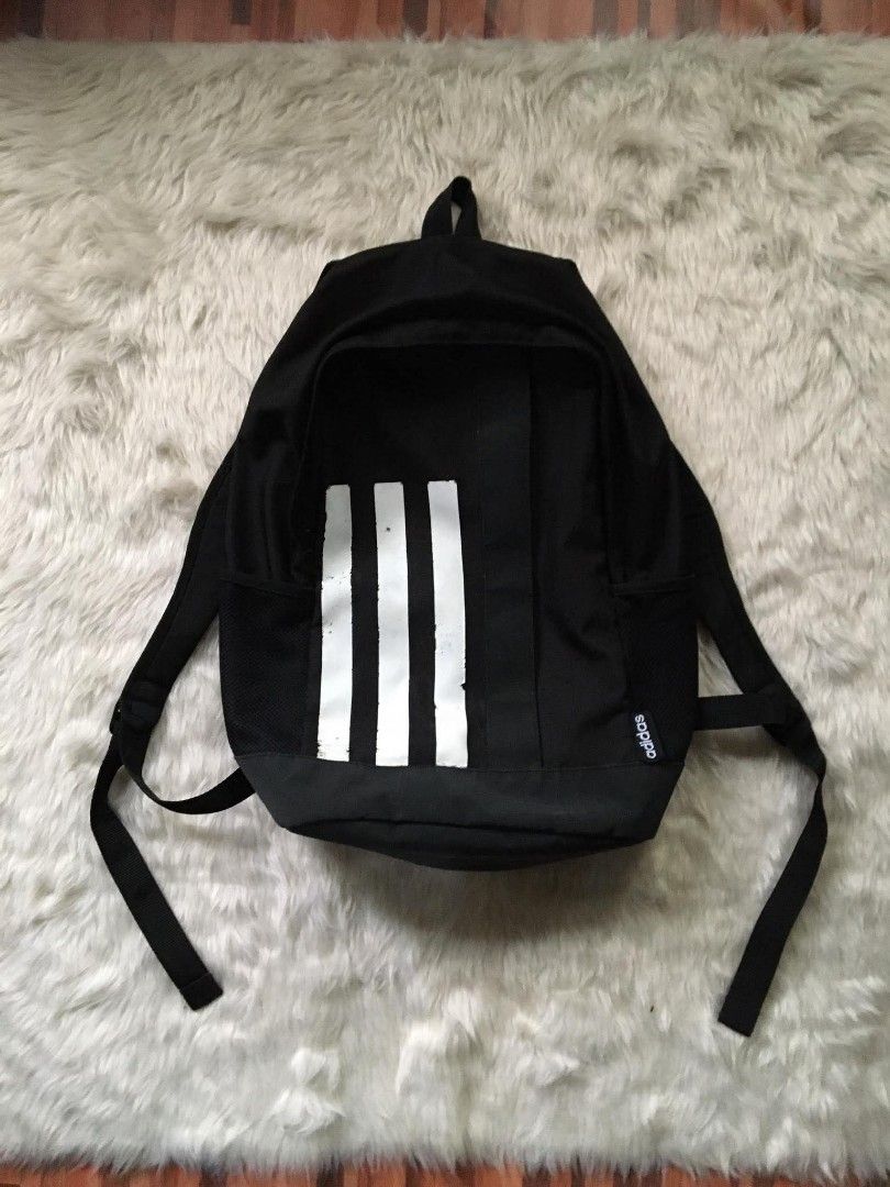 Adidas Black Backpack with White Stripes (Category: Backpacks) located in Manila. Submitted by reiyangelow (Listing ID 1470558880, Image 1). Description: adidas backpack issue slight crack prints 300php 📍 manila area .