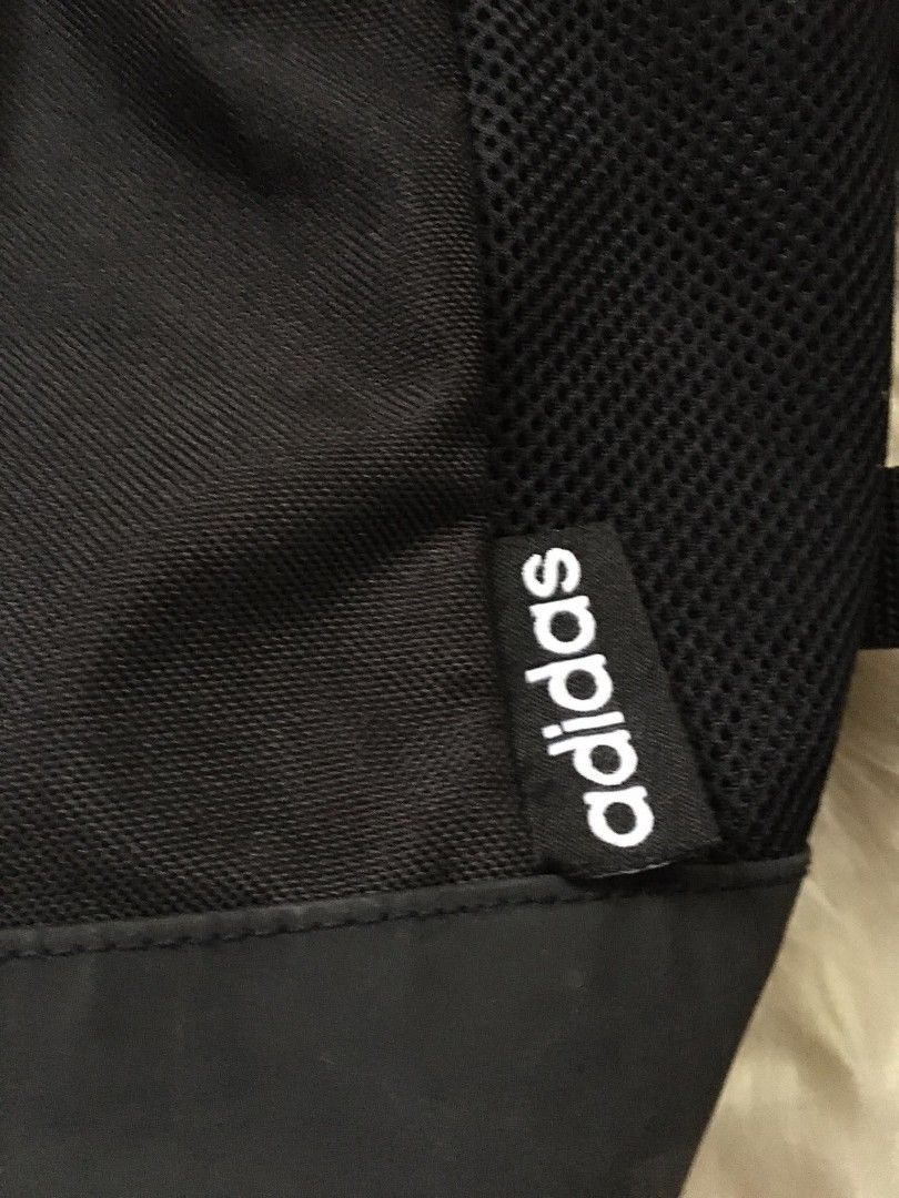 Adidas Black Backpack with White Stripes (Category: Backpacks) located in Manila. Submitted by reiyangelow (Listing ID 1470558880, Image 3). Description: adidas backpack issue slight crack prints 300php 📍 manila area .