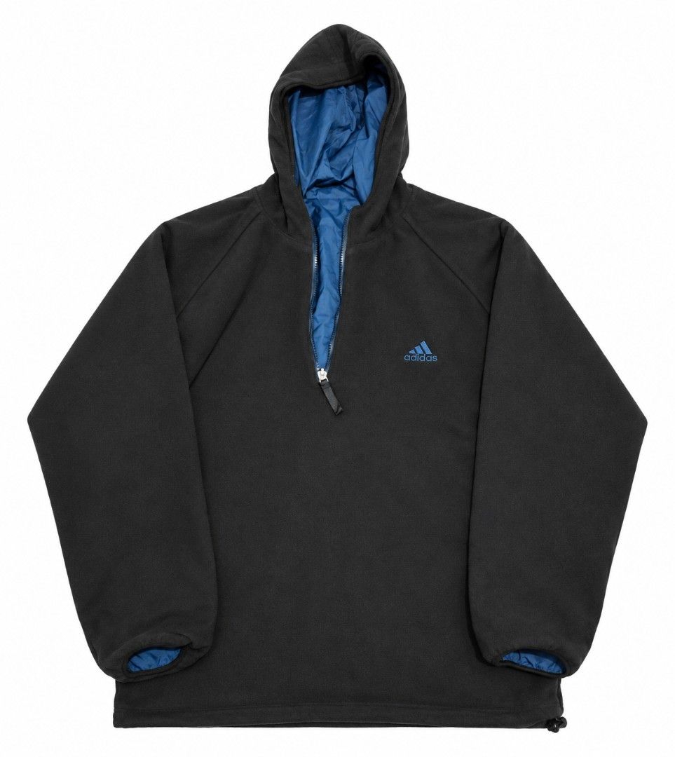 Adidas Blue Anorak Windbreaker Jacket (Category: Coats, Jackets and Outerwear) located in Bauang. Submitted by mr.acey (Listing ID 1470679752, Image 3). Description: - Authentic blue Adidas windbreaker with quarter zip and attached hood - Features a front kangaroo pocket and two secure side zippered pockets - Stylish dark blue contrast trim along seams and zipper paths - Classic embroidered Adidas logo on the upper chest - Lightweight shell mater