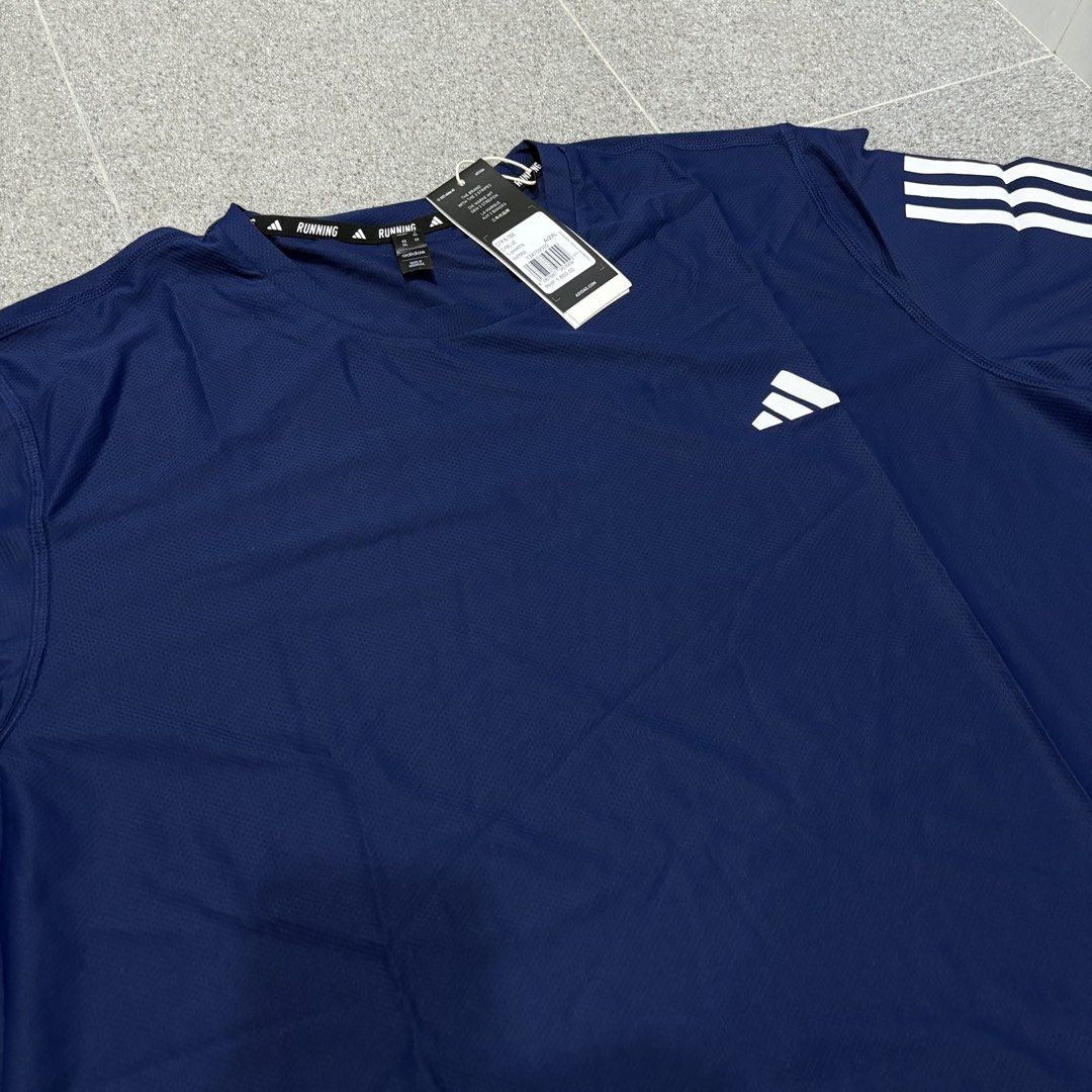 Adidas Blue Own The Run Tee (Category: Activewear) located in San Fernando. Submitted by louluntian (Listing ID 1470658760, Image 3). Description: Width = 24inch, Length = 31inch 𝐂𝐨𝐧𝐝𝐢𝐭𝐢𝐨𝐧: Needs washing | No issues 𝐋𝐨𝐜𝐚𝐭𝐢𝐨𝐧: Pampanga 𝐌𝐎𝐏: GCASH Only 𝐂𝐨𝐮𝐫𝐢𝐞𝐫: Lalamove | J&T Express (Shipping fee c/o buyer) .