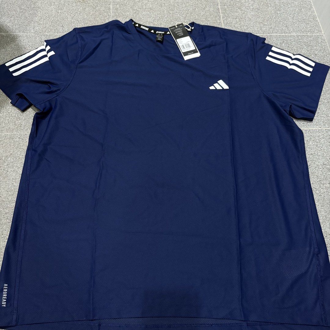 Adidas Blue Own The Run Tee (Category: Activewear) located in San Fernando. Submitted by louluntian (Listing ID 1470658760, Image 2). Description: Width = 24inch, Length = 31inch 𝐂𝐨𝐧𝐝𝐢𝐭𝐢𝐨𝐧: Needs washing | No issues 𝐋𝐨𝐜𝐚𝐭𝐢𝐨𝐧: Pampanga 𝐌𝐎𝐏: GCASH Only 𝐂𝐨𝐮𝐫𝐢𝐞𝐫: Lalamove | J&T Express (Shipping fee c/o buyer) .