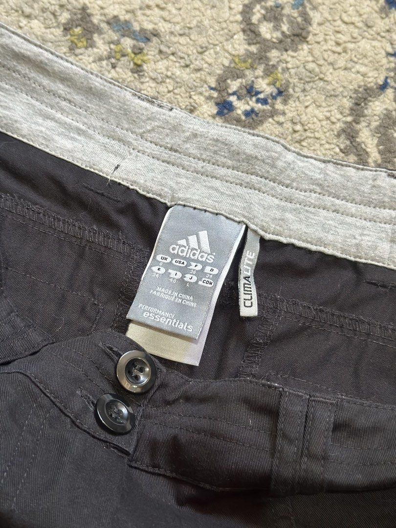 Adidas Climalite Black 3-Stripe Track Pants (Category: Joggers) located in Daet. Submitted by thrifthings2018 (Listing ID 1470567573, Image 3). Description: - Authentic Adidas performance track pants in classic black - Iconic white three-stripe detailing down both sides - Moisture-wicking Climalite fabric keeps you cool and dry - Dual-button waistband closure with contrast grey interior lining - Classic straight leg cut for a comfortable fit - Sm