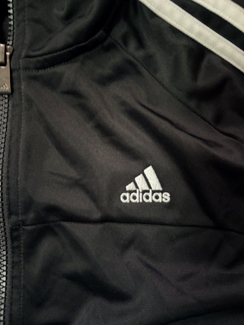 Adidas Climalite Black Track Jacket (Category: Activewear) located in Baguio. Submitted by rexyellowblue (Listing ID 1470617859, Image 3). Description: - Brand: Adidas - Color: Black with white three stripes - Size: Medium - Material/Tech: Climalite technology fabric - Features: Zip-up front, high collar, embroidered chest logo - Condition: Clean, excellent overall condition.