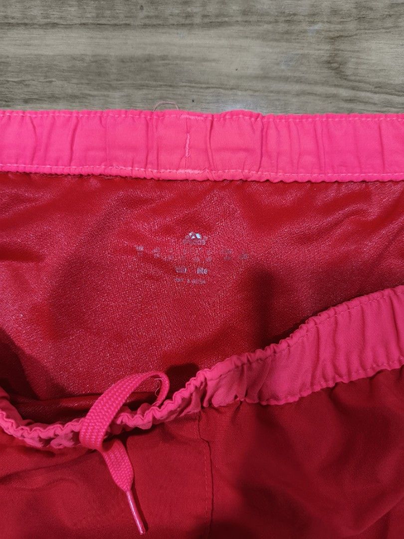 Adidas Climalite Pink Running Shorts Medium (Category: Activewear) located in Munoz. Submitted by toy_zone (Listing ID 1470674905, Image 3). Description: - Brand: Adidas - Color: Bright Pink - Material: Lightweight Climalite fabric for maximum comfort and breathability - Fit: Elastic waistband with adjustable drawstring - Design: Iconic three stripes on the sides - Origin: Made in Vietnam - Condition: Great for running, workouts, or casual wear N