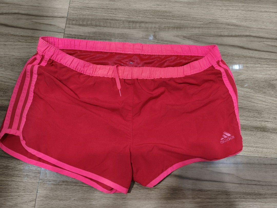 Adidas Climalite Pink Running Shorts Medium (Category: Activewear) located in Munoz. Submitted by toy_zone (Listing ID 1470674905, Image 1). Description: - Brand: Adidas - Color: Bright Pink - Material: Lightweight Climalite fabric for maximum comfort and breathability - Fit: Elastic waistband with adjustable drawstring - Design: Iconic three stripes on the sides - Origin: Made in Vietnam - Condition: Great for running, workouts, or casual wear N