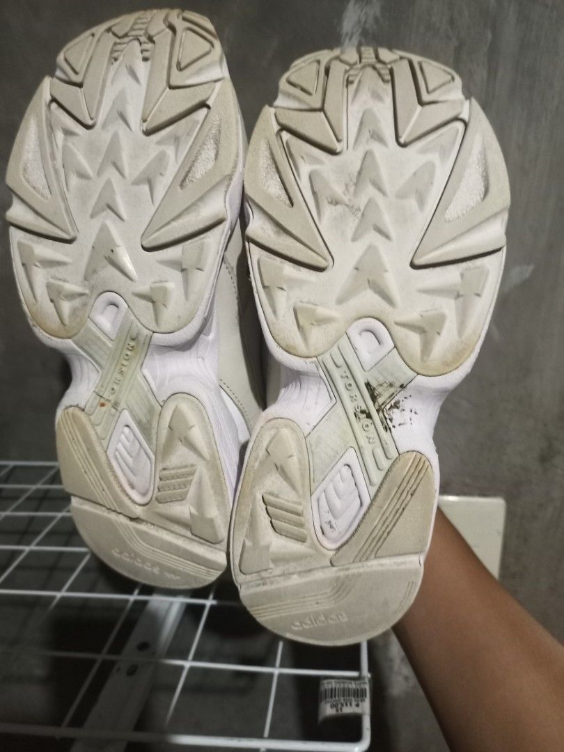 Adidas Falcon White Grey Chunky Sneakers (Category: Sneakers) located in Mabalacat. Submitted by hasashoe (Listing ID 1470610536, Image 2). Description: - Brand: Adidas Falcon chunky sneakers - Colorway: Classic white and grey - Size: Women's US 9 / UK 7.5 / EU 41 1/3 - Material: Mesh and leather upper panels with Torsion system outsole support - Condition: Clean white midsoles with slight wear on the tread; original tongue size tag intact - Styl