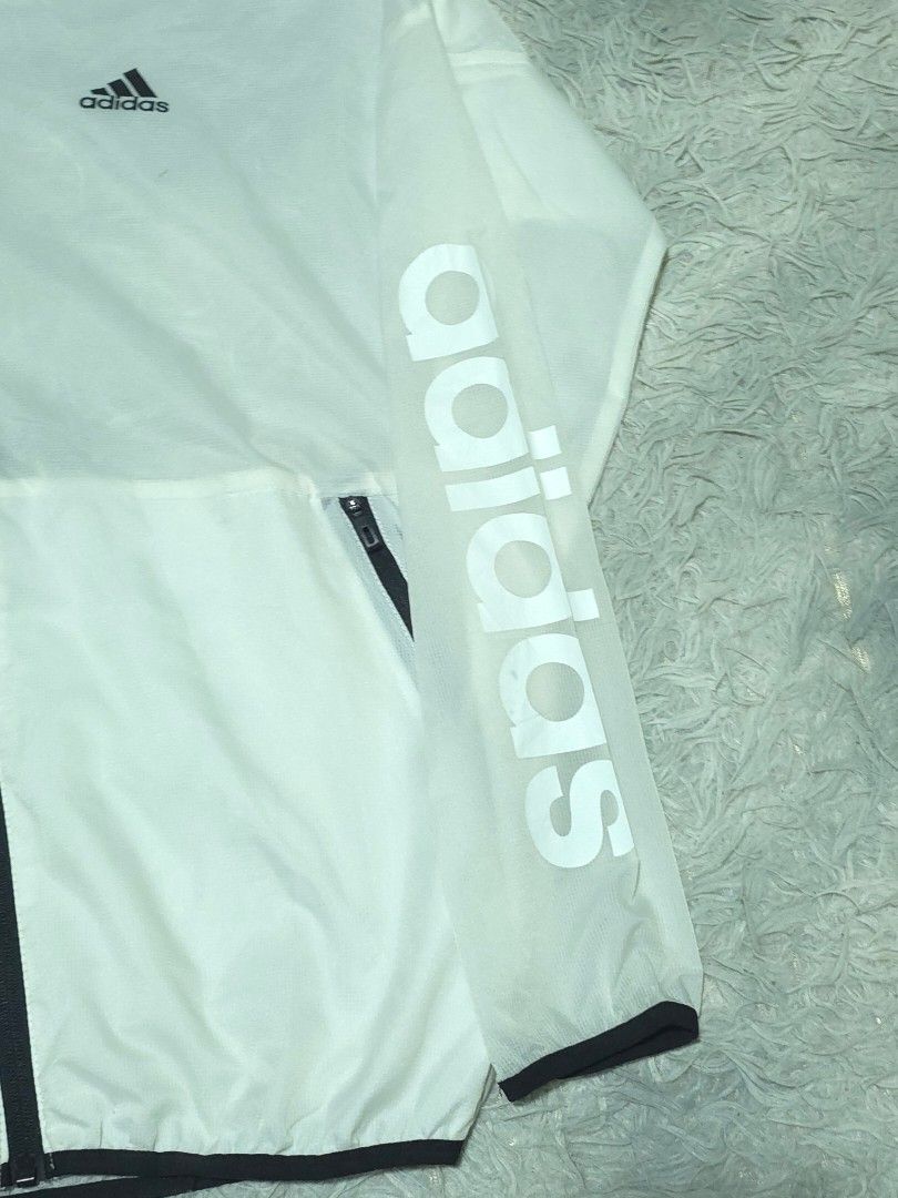 Adidas Lightweight Windbreaker (Category: Coats, Jackets and Outerwear) located in Abulug. Submitted by humanwhosellthings (Listing ID 1470560357, Image 2). Description: ADIDAS LIGHTWEIGHT WINDBREAKER JACKET ✅️Size: Small on tag fit to Medium ✅️Dimes: 20W x 26L ✅Condition: Excellent ✅Issue: needs wash only ✅Color Rate: 9.8/10.