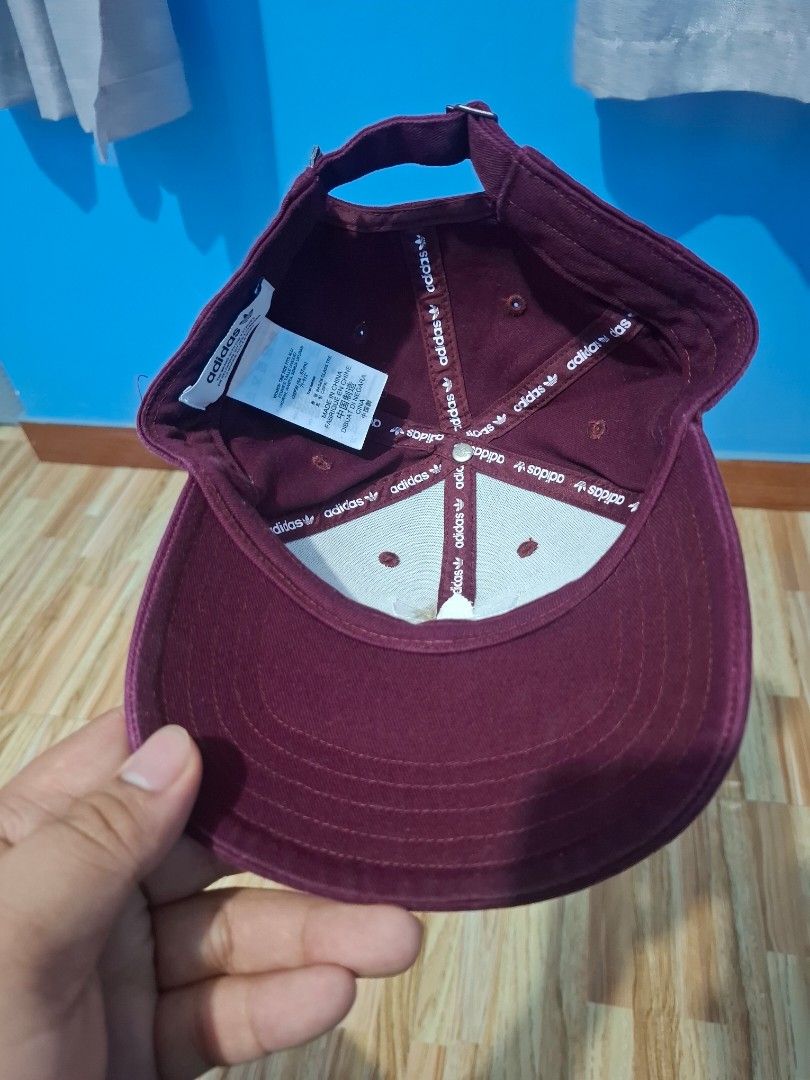 Adidas Maroon Baseball Cap Trefoil Logo (Category: Caps & Hats) located in Cagayan de Oro. Submitted by ramjim.newaccount (Listing ID 1470579265, Image 2). Description: - Brand: Adidas - Color: Rich maroon with white embroidered Trefoil logo - Size: OSFW (Adjustable back strap) - Details: Branded interior tape lining and original tags - Origin: Made in China - Condition: Clean structure, vibrant color, ready to wear.