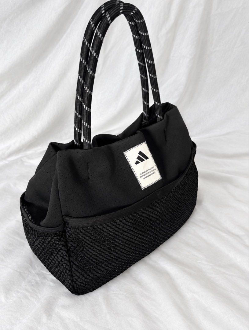 adidas Must Haves Tote Bag (Category: Tote Bags) located in Manila. Submitted by coollion_7aaba1 (Listing ID 1470565156, Image 2). Description: Seasonal design featuring a textured front mesh pocket. Condition: Brand new Source: Bought in Japan Now selling at a much lower price Authenticity guaranteed. Original price 3k.