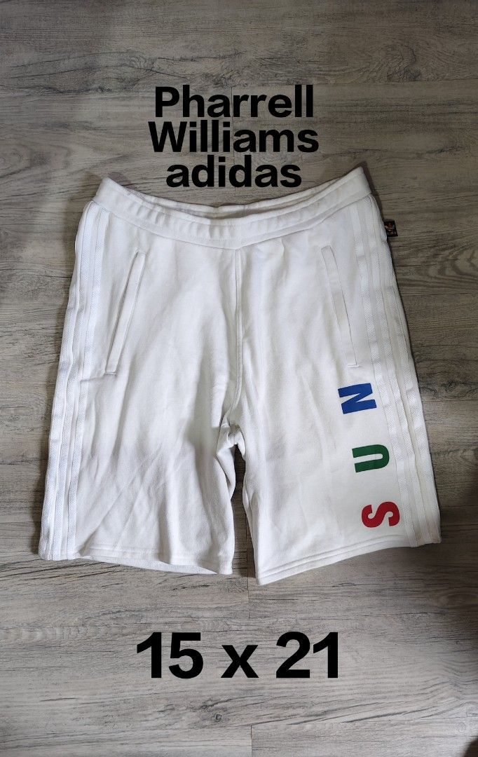 Adidas Pharrell Williams Hu Sun Calm Shorts (Category: Shorts) located in Quezon City. Submitted by truedeer_cda94c (Listing ID 1470602562, Image 1). Description: - Authentic Adidas Pharrell Williams collection - Color: Crisp white with multi-color details - Design: 'SUN' and 'CALM' text on legs, Hu triangle logo on back - Storage: Secure side zip pockets with adjustable drawstring waistband - Details: Colorful embroidered Adidas trefoil tag - Ma