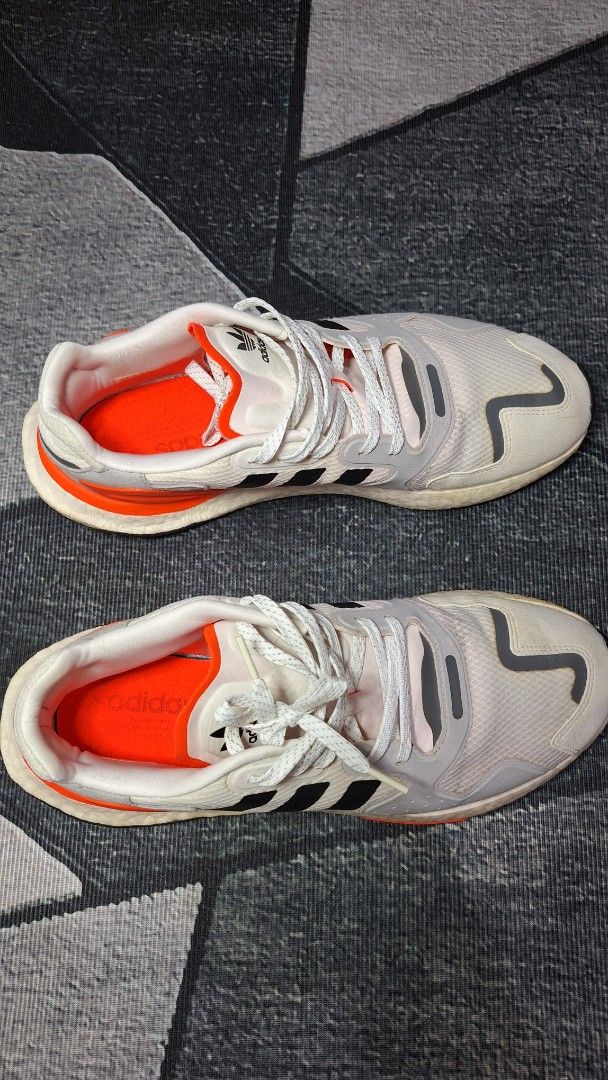 Adidas Response CL White Black Orange Sneakers (Category: Casual Shoes) located in Mandaluyong City. Submitted by erick1213_ (Listing ID 1470682639, Image 2). Description: - Brand/Model: Adidas Response CL - Colorway: White mesh base with iconic black stripes and bright orange accents - Comfort & Tech: Chunky Boost midsole for superior cushioning - Safety/Style: Reflective details on the toe and upper - Grip: Durable rubber outsole with solid tra