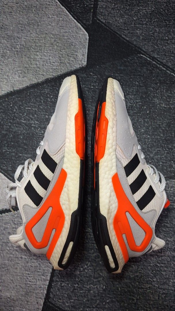 Adidas Response CL White Black Orange Sneakers (Category: Casual Shoes) located in Mandaluyong City. Submitted by erick1213_ (Listing ID 1470682639, Image 3). Description: - Brand/Model: Adidas Response CL - Colorway: White mesh base with iconic black stripes and bright orange accents - Comfort & Tech: Chunky Boost midsole for superior cushioning - Safety/Style: Reflective details on the toe and upper - Grip: Durable rubber outsole with solid tra