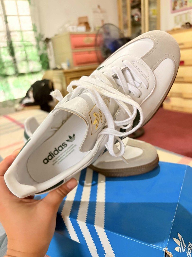 Adidas Samba OG Green White US 9.5 (Category: Sneakers) located in Cavite. Submitted by Jas.Corner (Listing ID 1470679995, Image 2). Description: - Model: Adidas Samba OG - Colorway: Cloud White / College Green - Size: US 9.5 / UK 9 / FR 43 1/3 - Materials: Classic leather upper with suede toe overlay and gum rubber sole - Details: Signature gold foil Samba lettering on the side - Condition: Brand new with original blue shoebox and intact label -