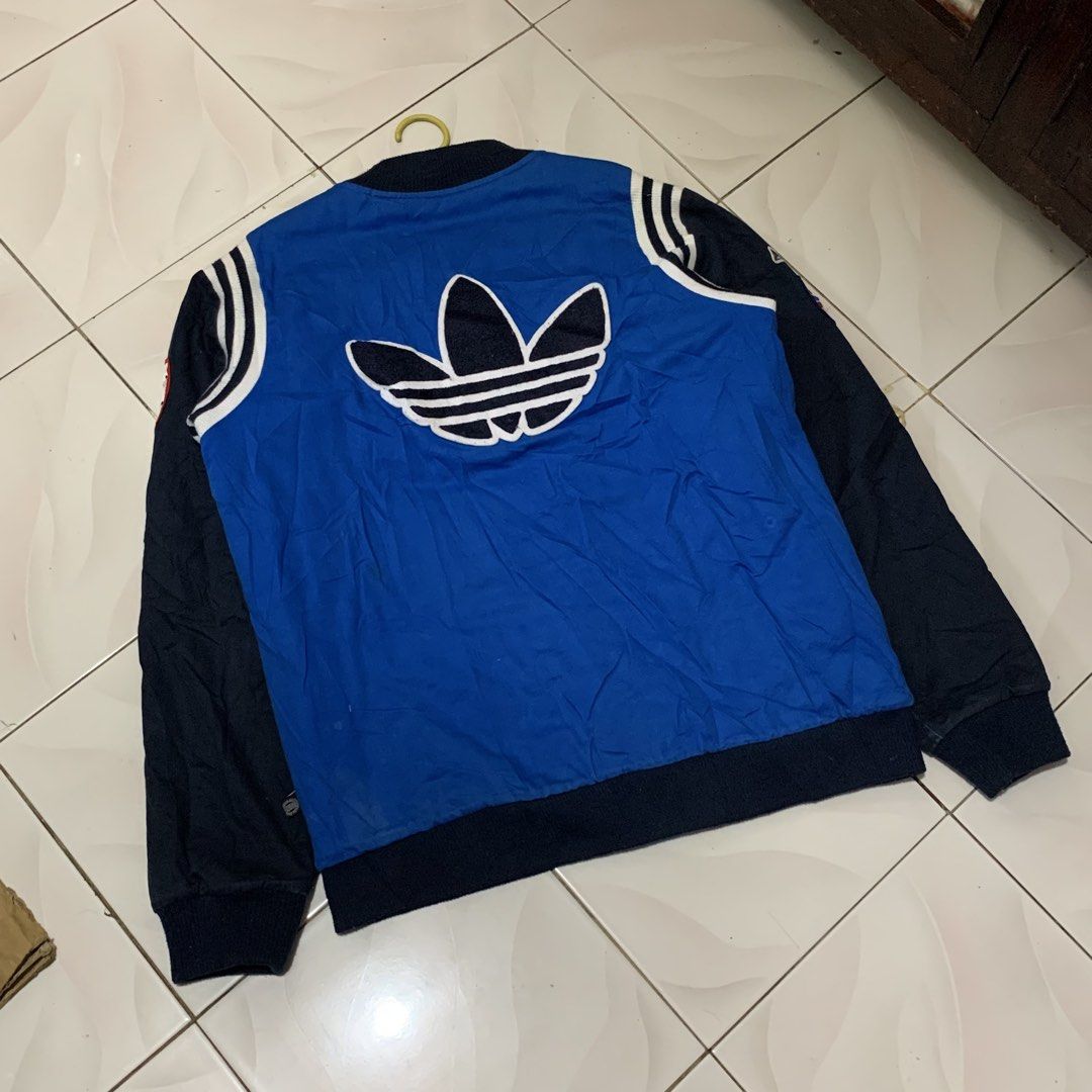 Adidas trefoil varsity big logo jacket (Category: Coats, Jackets and Outerwear) located in Bacolod City. Submitted by dasmarinascarlo (Listing ID 1470663395, Image 2). Description: Adidas trefoil varsity big logo vintage jacket • Color: Royal blue, Dark navy, Red & White •Dimesions :Width 24 :Length 28.5 • Condition: Good Condition (Lightly Used) •Color rate: 9/10 📩 Message me for inquiries! 📦 Available for shipping. Please check the photos and