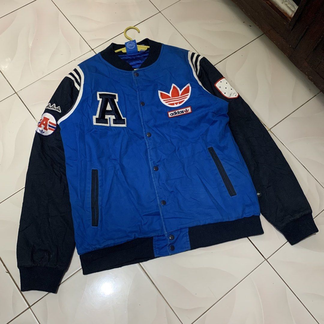 Adidas trefoil varsity big logo jacket (Category: Coats, Jackets and Outerwear) located in Bacolod City. Submitted by dasmarinascarlo (Listing ID 1470663395, Image 1). Description: Adidas trefoil varsity big logo vintage jacket • Color: Royal blue, Dark navy, Red & White •Dimesions :Width 24 :Length 28.5 • Condition: Good Condition (Lightly Used) •Color rate: 9/10 📩 Message me for inquiries! 📦 Available for shipping. Please check the photos and