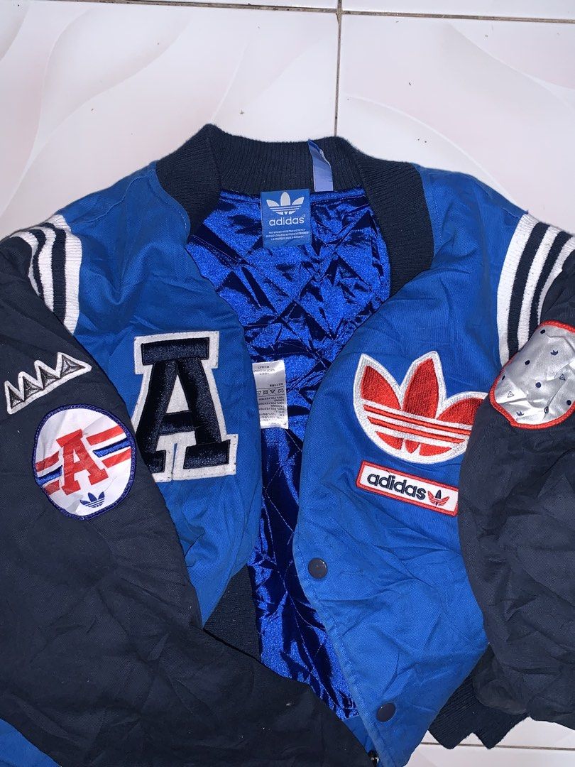 Adidas trefoil varsity big logo jacket (Category: Coats, Jackets and Outerwear) located in Bacolod City. Submitted by dasmarinascarlo (Listing ID 1470663395, Image 3). Description: Adidas trefoil varsity big logo vintage jacket • Color: Royal blue, Dark navy, Red & White •Dimesions :Width 24 :Length 28.5 • Condition: Good Condition (Lightly Used) •Color rate: 9/10 📩 Message me for inquiries! 📦 Available for shipping. Please check the photos and