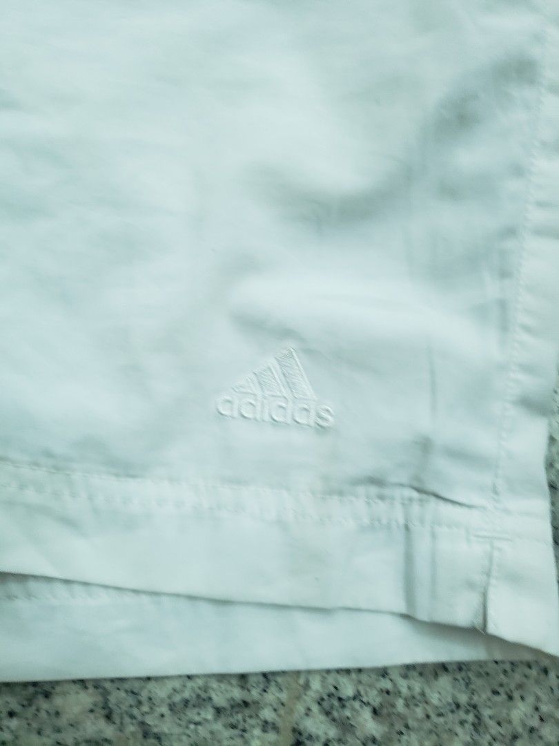 Adidas White Sports Shorts with Drawstring Size M (Category: Shorts) located in Pagsanghan. Submitted by yuchinz (Listing ID 1470661982, Image 2). Description: - Color: White - Brand: Adidas - Material: Lightweight fabric, ideal for workouts and casual wear - Waistband: Elastic with adjustable drawstring - Details: Embroidered Adidas logo on the left leg - Condition: Brand new with clear inside branding and size tags.