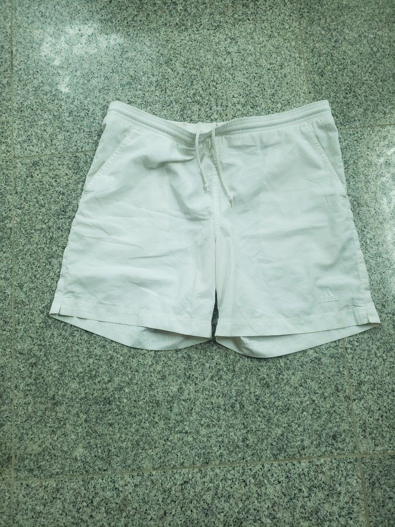 Adidas White Sports Shorts with Drawstring Size M (Category: Shorts) located in Pagsanghan. Submitted by yuchinz (Listing ID 1470661982, Image 1). Description: - Color: White - Brand: Adidas - Material: Lightweight fabric, ideal for workouts and casual wear - Waistband: Elastic with adjustable drawstring - Details: Embroidered Adidas logo on the left leg - Condition: Brand new with clear inside branding and size tags.