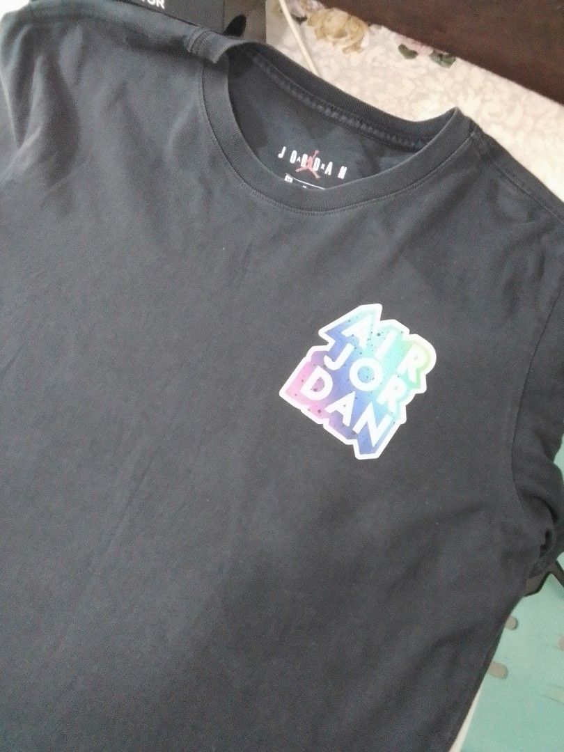 Air Jordan Graphic Tee Black (Category: Tshirts & Polo Shirts ) located in Manila. Submitted by jctclthng_2026 (Listing ID 1470618952, Image 1). Description: - Brand: Jordan - Color: Black Graphic Tee - Size: Tag M (Chest: 95cm, Height: 165-175cm) - Condition: Good pre-loved condition, pinhole, slightly unnoticeable..