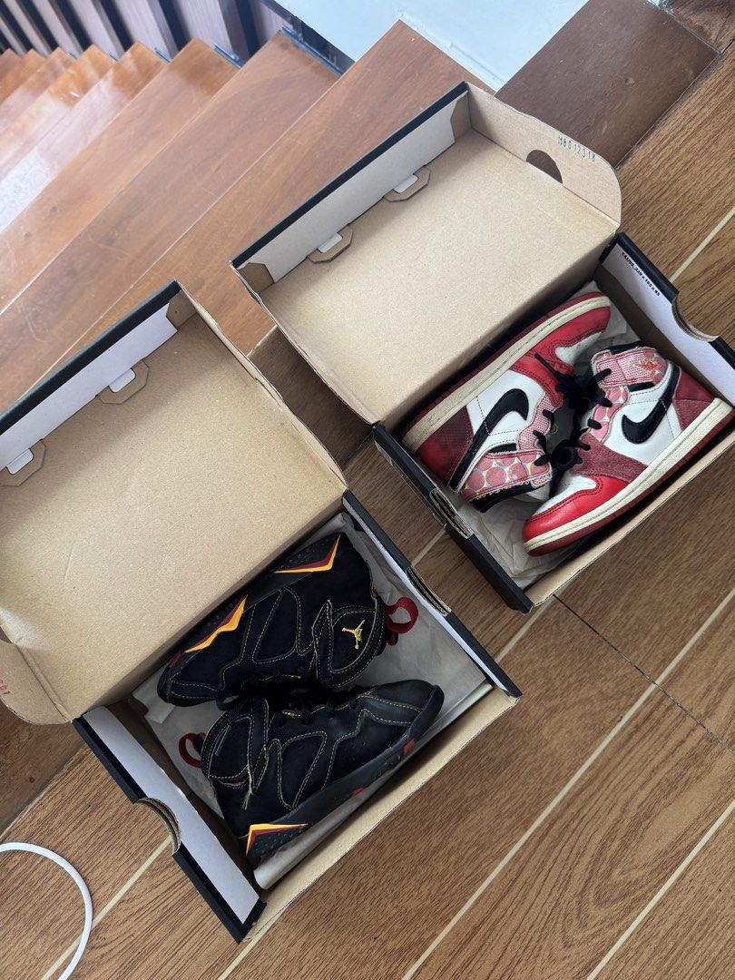 Air Jordan Sneakers Bundle (Category: Babies & Kids Fashion) located in Rizal. Submitted by mharieshine (Listing ID 1470582473, Image 1). Description: - 2 pairs of authentic Air Jordan sneakers with original packaging - Pair 1: Classic Chicago red and white colorway with textured overlays - Pair 2: Black upper with striking gold and red accents - Both pairs come complete in their original boxes - Ideal pickups for sneaker fans, ballers, and serio