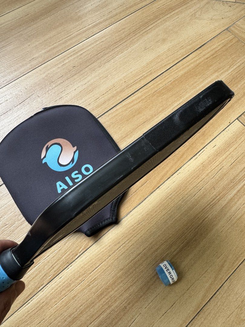 Aiso Ryu Pickleball Paddle 15mm with Cover (Category: Racket and Ball Sports) located in Rodriguez. Submitted by cords.treasure (Listing ID 1470585375, Image 3). Description: The Aiso Ryu blends premium materials with an innovative design to deliver a paddle that commands precision, control, and adaptability. Inspired by its namesake, the “Dragon”, the Ryu is engineered for players who value finesse in the soft game without sacrificing aggression