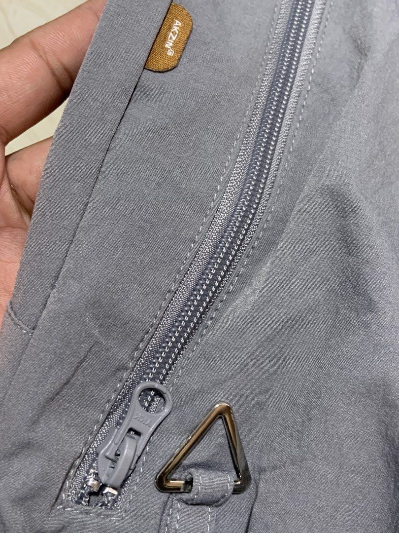Akzin Grey Athletic Shorts Size M. -missing lace (Category: Activewear) located in Angeles City. Submitted by manlapidma26771 (Listing ID 1470579095, Image 3). Description: - Brand/Model: Akzin grey athletic shorts - Size: Medium - Waistband: Elastic with metal eyelets - Pockets: Secure zipped side pockets with premium YKK zippers - Details: Small white AK logo near the hem and triangle hardware loop near the left pocket.