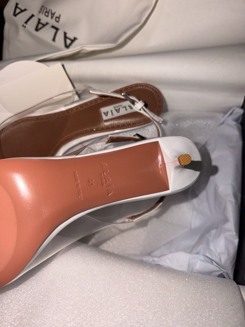 Alaïa Paris White and Clear Slingback Heels Size 41 (Category: Heels) located in Las Pinas. Submitted by twiceloved24 (Listing ID 1470638446, Image 2). Description: - Brand: Alaïa Paris - Style: Slingback kitten heels with pointed toe and adjustable buckle ankle strap - Materials: Clear PVC, white trim, and premium brown leather inner soles - Size: EU 41 - Origin: Made in Italy - Inclusions: Original dust bag and box - Condition: Excellent/Like n