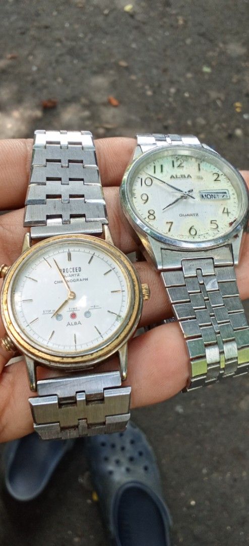 Alba Proceed Quartz Chronograph and Alba Quartz Watch Bundle (Category: Men's Watches) located in Daanbantayan. Submitted by mvs08_collectibles (Listing ID 1470587147, Image 1). Description: - Bundle of 2 vintage Alba quartz watches with metal link bracelets - Watch 1: Alba Proceed chronograph (V692-6010) featuring a white dial and gold-tone bezel - Watch 2: Classic dial with easy-to-read Arabic numerals and a day-date window at 3 o'clock - Condi