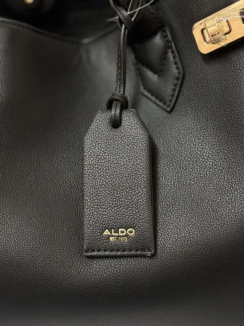 Aldo Black Large Tote Bag with Gold Hardware (Category: Tote Bags) located in Paranaque City. Submitted by cerise_1406 (Listing ID 1470666278, Image 3). Description: VERY NEGOTIABLE - Never Used - Condition: New - Color: Black, with Gold Hardware Dimensions (Tape Measured) Length: Opening-16 in, Bottom-14.5 in Width: 6.3 in Height: 10.5 in.