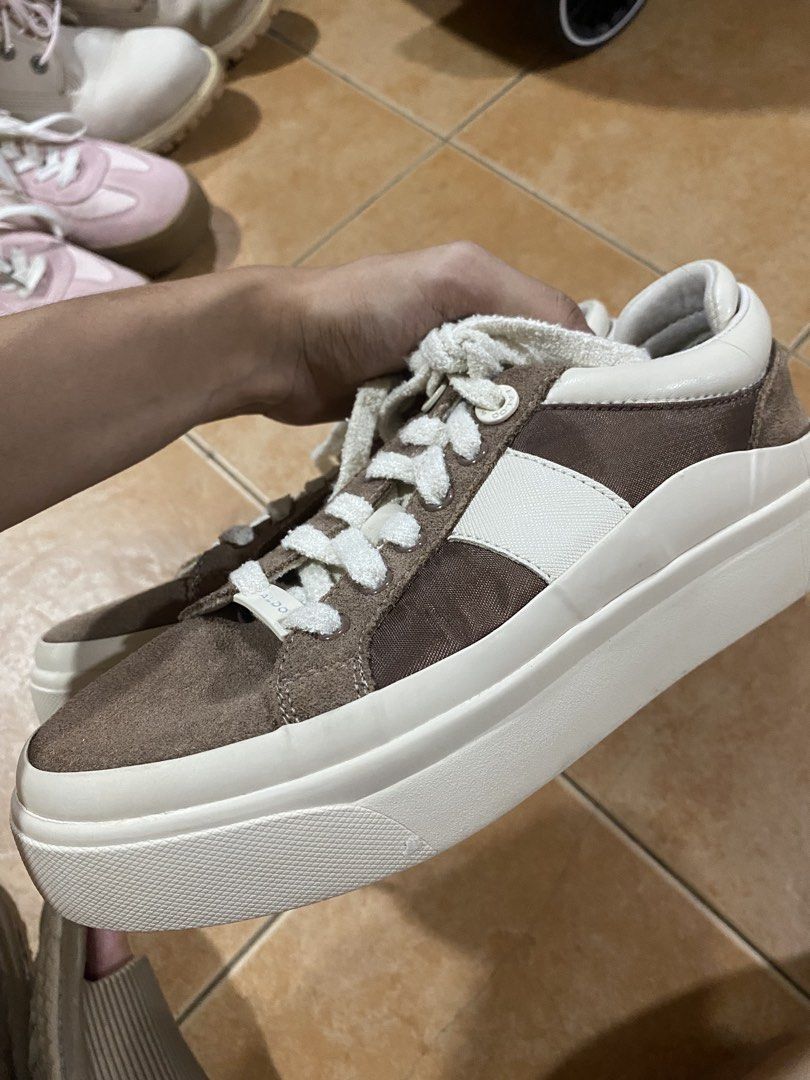 ALDO Brown and White Platform Sneakers (Category: Sneakers) located in Taguig. Submitted by mumpreloveddd (Listing ID 1470619513, Image 2). Description: - Brand: ALDO - Style: Platform sneakers in brown and white colorway - Size: US 6 / EUR 36 / UK 3 - Details: Chunky white laces, branded ALDO lace lock, suede and fabric panels - Sole: Thick rubber sole for extra comfort and height - Condition: Clean inside and out, well-maintained - Best for: St
