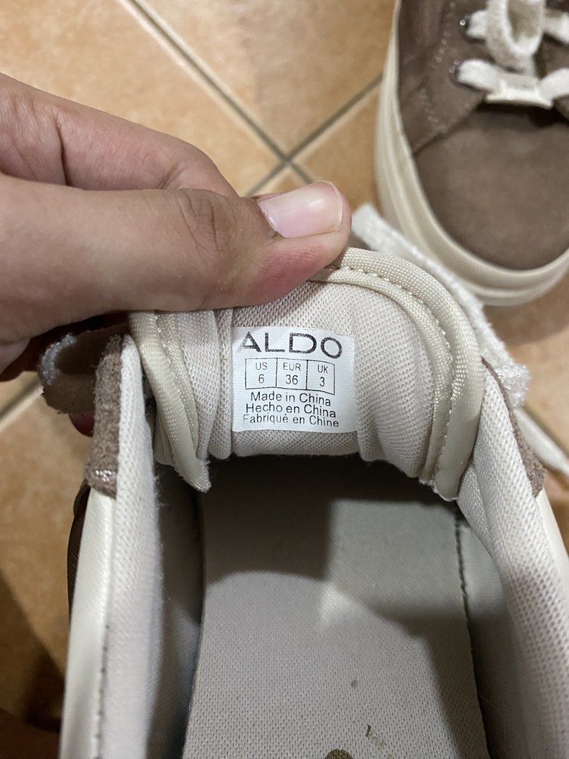 ALDO Brown and White Platform Sneakers (Category: Sneakers) located in Taguig. Submitted by mumpreloveddd (Listing ID 1470619513, Image 3). Description: - Brand: ALDO - Style: Platform sneakers in brown and white colorway - Size: US 6 / EUR 36 / UK 3 - Details: Chunky white laces, branded ALDO lace lock, suede and fabric panels - Sole: Thick rubber sole for extra comfort and height - Condition: Clean inside and out, well-maintained - Best for: St