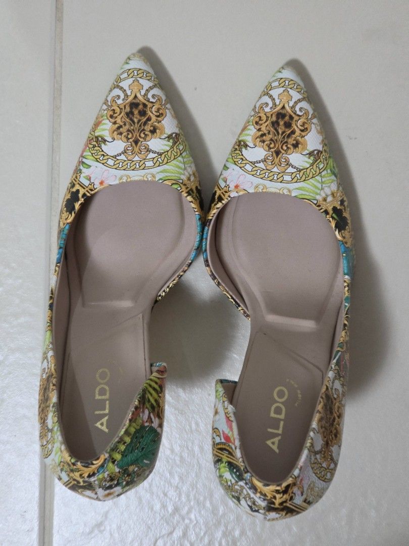 ALDO Tropical Baroque Print High Heels (Category: Heels) located in Taguig. Submitted by m_lim (Listing ID 1470717858, Image 1). Description: - Brand: ALDO - Style: High heels with pointed toe and gold metallic stiletto heel - Design: Striking tropical baroque print mixing leopard print, gold chains, and vibrant green leaves - Comfort: Cushioned insoles for all-day wear - Condition: Worn once or twice, minor wear on soles - Perfect statement shoe