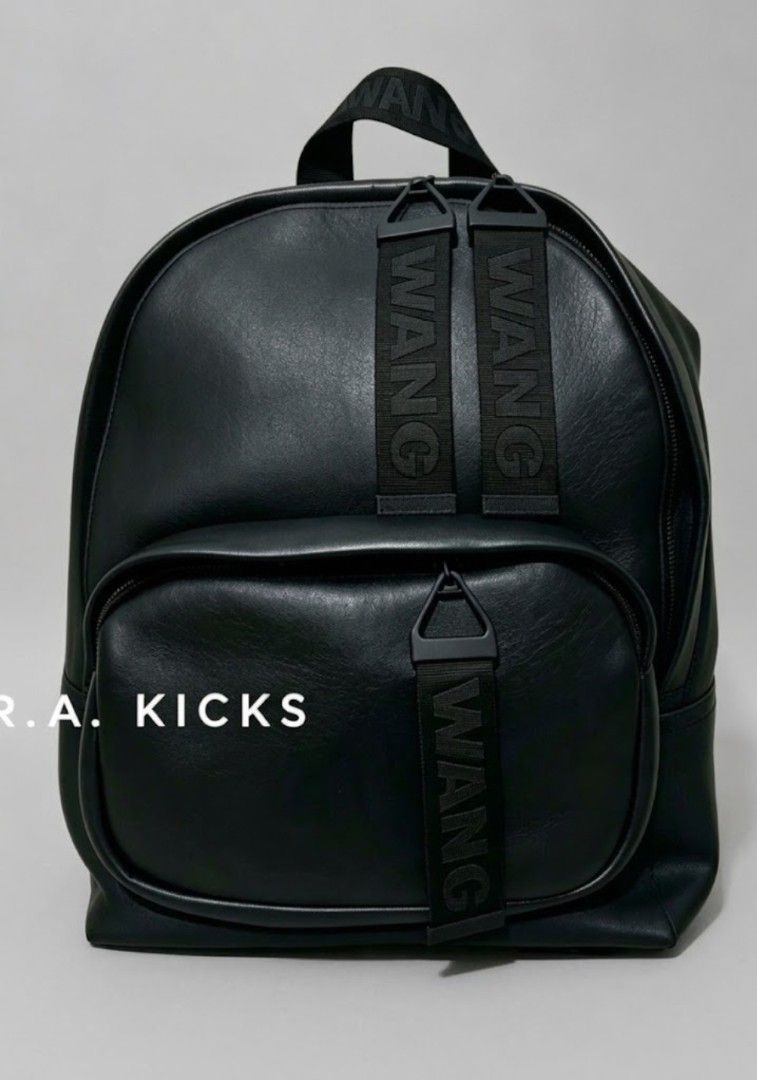 Alexander Wang H&M Black Leather Backpack (Category: Backpacks) located in Quezon City. Submitted by r.a.kicks (Listing ID 1470625563, Image 1). Description: 45% off! [SRP is 10K] Alexander Wang X H&M collab - Pure Leather backpack (Only 10 sold in PH during H&M Megamall Opening) Details: 100% leather/size: 35CM X 40CM. With Adjustable ahoulder straps. One outer compartment wd a zipper & one inner compartment. Woven logo details with rubber reinf