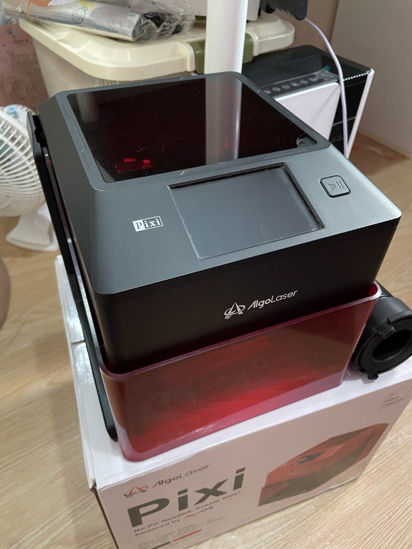 AlgoLaser Pixi Smart Laser Engraver with Rotary Roller (Category: Printers, Scanners & Copiers) located in Manila. Submitted by artypaper_25 (Listing ID 1470662614, Image 1). Description: - AlgoLaser Pixi Smart Laser Engraver 5W black with AlgoOS touchscreen interface - Standalone operation: No PC required - Class 1 laser safety certified for secure use - Includes original retail box, quick start guides, enclosure base, and exhaust attachment - C