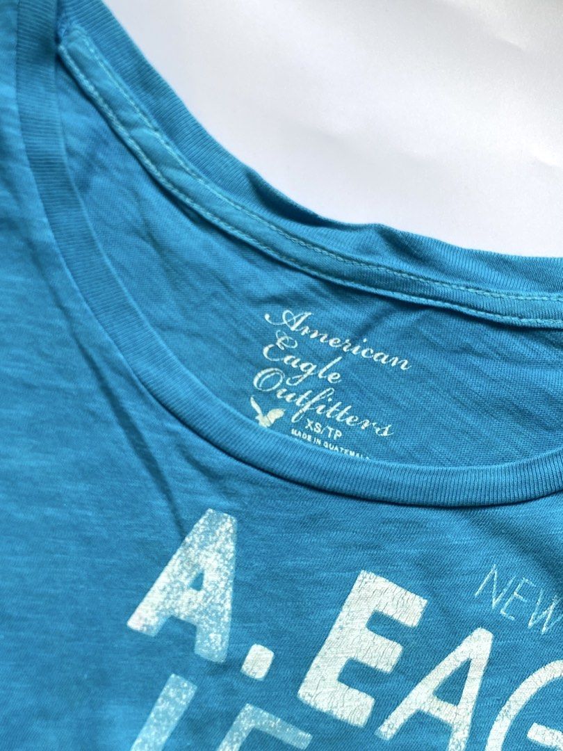 American Eagle Outfitters Teal Graphic Tee (Category: Shirts) located in Manila. Submitted by petalfinds_ (Listing ID 1470644004, Image 2). Description: ˚⊱🪷⊰˚ turquoise vintage fitted shirt ౨ৎ 𝐛𝐫𝐚𝐧𝐝: american eagle outfitters ౨ৎ 𝐬𝐢𝐳𝐞: xs to small 🫧⋆｡˚ 𝐝𝐞𝐭𝐚𝐢𝐥𝐬: GANDAAAAA! very y2k vibes! no issue! ─── ⋆⋅☆⋅⋆ ── 「 ✦ 𝐍𝐎 𝐂𝐎𝐃𝐄, 𝐈𝐍𝐕𝐀𝐋𝐈𝐃 𝐌𝐈𝐍𝐄 ✦ 」 𝓹𝓻𝓲𝓬𝓮: 149 𝓬𝓸𝓭𝓮: mirage.