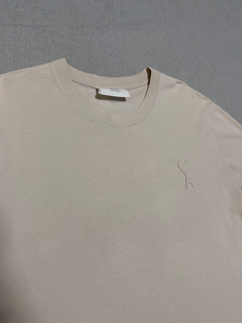 AMI Embossed Logo Tee (Category: Luxury Apparel) located in Bulacan. Submitted by sanjisthrift (Listing ID 1470653033, Image 2). Description: Size XL Oversized Width 23 Length 30 Excellent Condition 9/10 Need wash.