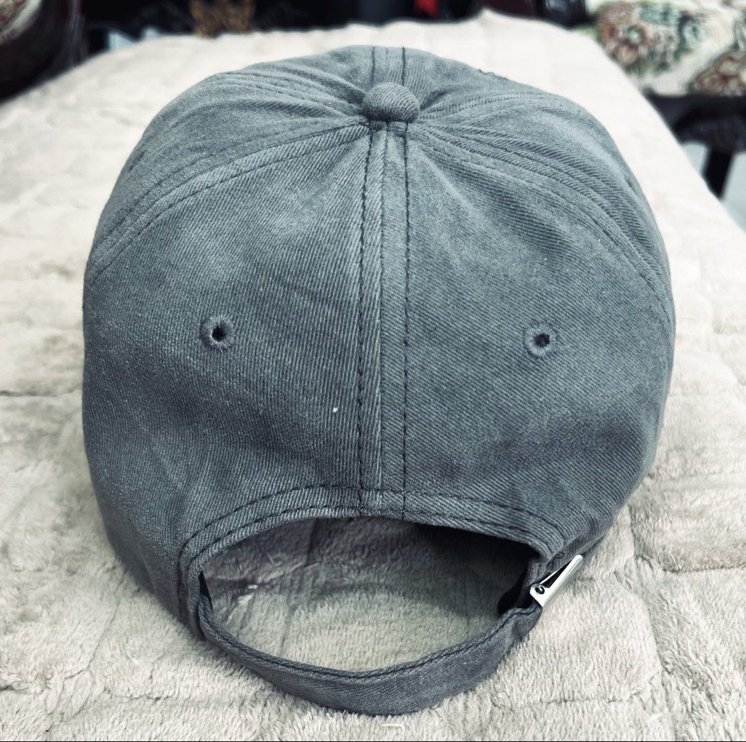AMI Paris Ami de Cœur Gray Distressed Baseball Cap (Category: Caps & Hats) located in Imus. Submitted by eacaps (Listing ID 1470596245, Image 3). Description: AMI Paris gray/charcoal baseball cap featuring the Ami de Cœur heart-and-A logo on the front. Details include a curved brim, adjustable back strap with metal buckle, and distressed white detailing on the brim. Condition: Pre-owned with minimal signs of wear. Made in Portugal. Actual item pi