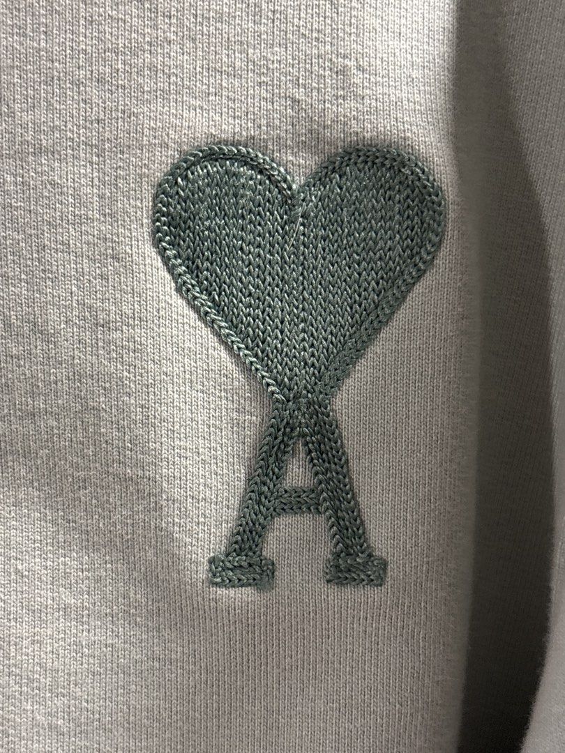 Ami Paris Green Heart Logo Sweatshirt (Category: Coats, Jackets and Outerwear) located in Tarlac. Submitted by somethinboutgyu (Listing ID 1470675701, Image 3). Description: - Brand: Ami Paris - Color: Mint Green - Condition: Like new (worn once for photos) - Features: Embroidered tonal heart & A logo, classic crewneck, ribbed cuffs and hem - Material: Soft, premium cotton - Origin: Made in Portugal - Fit: Relaxed fit.