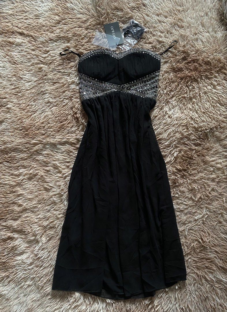 AMY & JO Black Beaded Strapless Dress (Category: Dresses) located in Manila. Submitted by stormibutterfly26 (Listing ID 1470592272, Image 1). Description: - Brand: AMY & JO - Color: Black with gorgeous silver beading and sequins on the sweetheart bodice - Design: Flowy pleated skirt for an elegant silhouette - Condition: Brand new with original tags attached, never worn - Extras: Includes detachable straps sealed in plastic.
