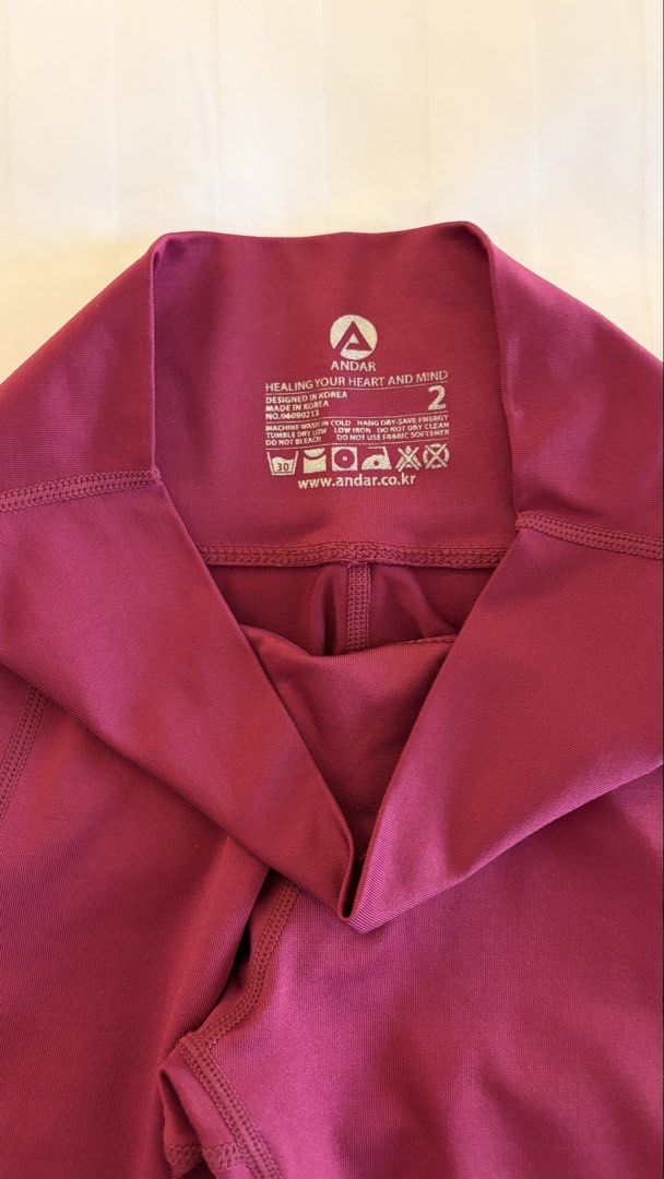 Andar Athletic Leggings Maroon Size 2 (Category: Activewear) located in Manila. Submitted by letmeclean (Listing ID 1470668992, Image 2). Description: - Brand: Andar (Designed in Korea) - Size: 2 - Color: Rich maroon - Style: High waist with convenient side pockets - Fabric: Smooth, stretchy, and premium athletic material - Condition: Clean, well-maintained, and ready to wear.