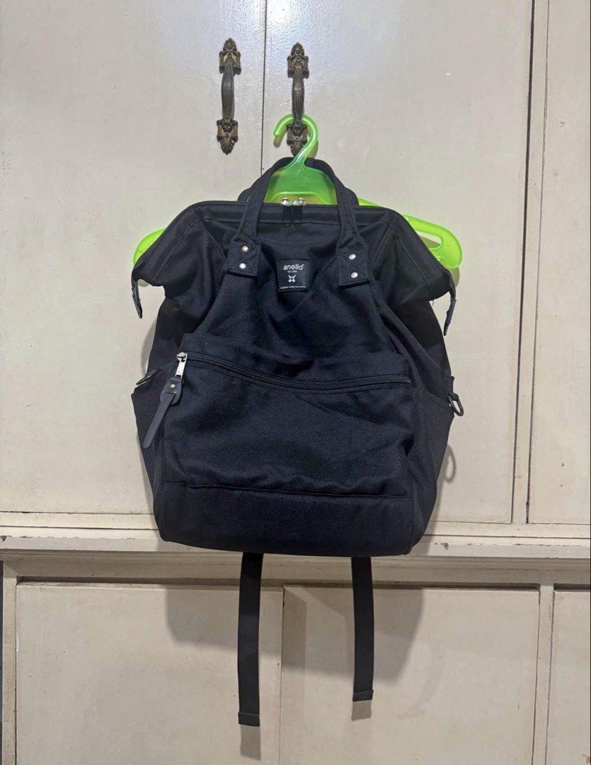 Anello Black Backpack Laptop Bag (Category: Backpacks) located in Manila. Submitted by chicken.lover (Listing ID 1470643405, Image 1). Description: - Color: Classic Black - Material: Sturdy, durable canvas with clean interior lining - Compartments: Wide-opening main compartment for easy packing - Laptop Storage: Built-in padded laptop sleeve plus convenient slip pockets - Quick Access: Front zippered pocket for small essentials - Carry Options: A