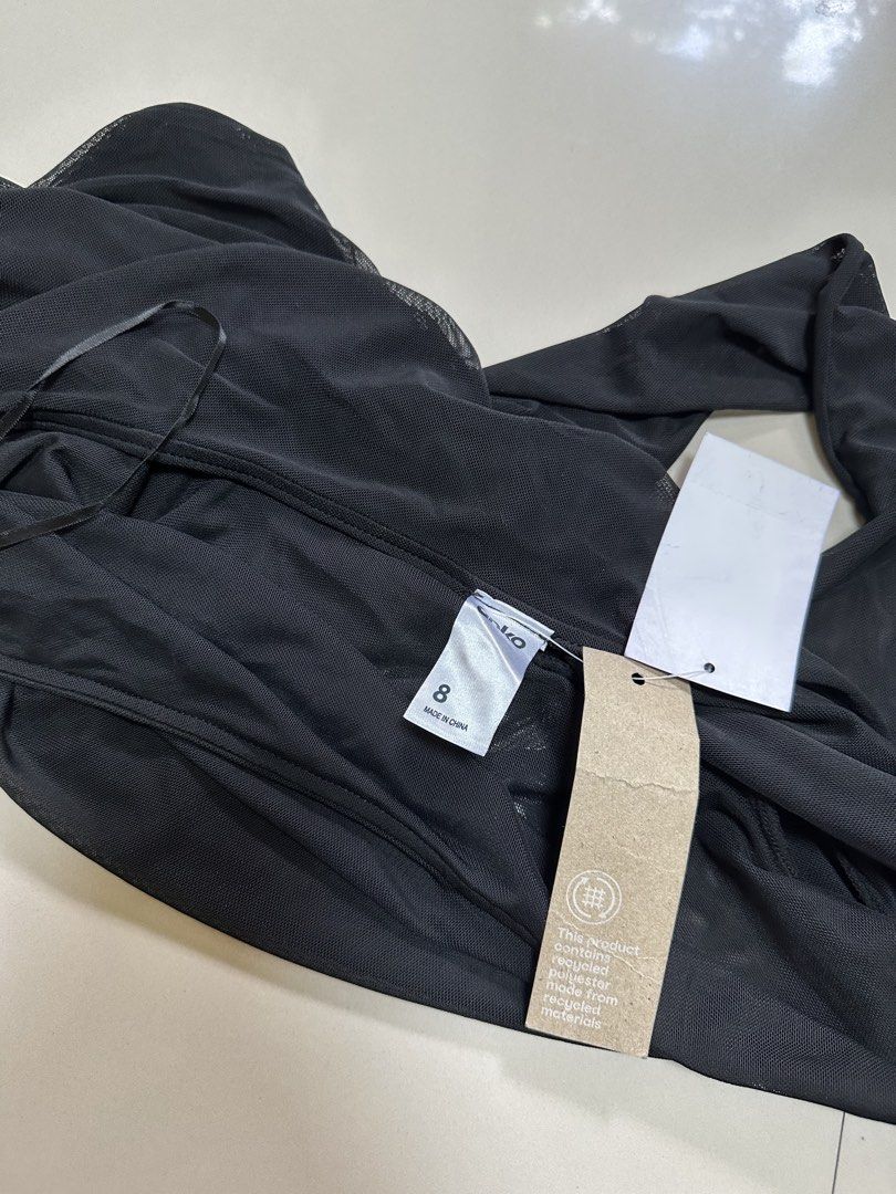 Anko Black Ruched Mesh Off-Shoulder Top (BNWT) (Category: Others Tops) located in Davao. Submitted by theresetshelf (Listing ID 1470615500, Image 2). Description: • Anko (comes with original tags attached) • Sheer, lightweight, and highly breathable mesh fabric • Flattering ruched bodice that hugs your curves • Off-the-shoulder / boat neck styling • Long sleeves with feminine lettuce-trim cuffs .