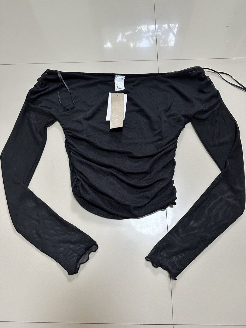 Anko Black Ruched Mesh Off-Shoulder Top (BNWT) (Category: Others Tops) located in Davao. Submitted by theresetshelf (Listing ID 1470615500, Image 1). Description: • Anko (comes with original tags attached) • Sheer, lightweight, and highly breathable mesh fabric • Flattering ruched bodice that hugs your curves • Off-the-shoulder / boat neck styling • Long sleeves with feminine lettuce-trim cuffs .