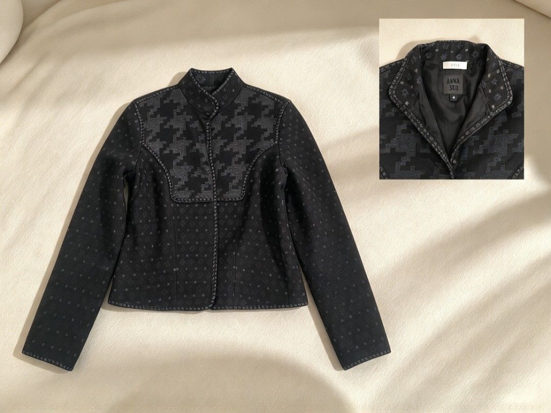 Anna Sui Black Patterned Jacket Size 4 (Category: Coats, Jackets and Outerwear) located in Batangas. Submitted by mace2014 (Listing ID 1470575362, Image 1). Description: - Brand: Anna Sui - Size: 4 - Color: Black with houndstooth and geometric patterns - Style: High collar, button front closure, and dark interior lining - Details: Unique patterned piping trim along the edges - Condition: Well-maintained and ready to wear - Perfect for: Statement 